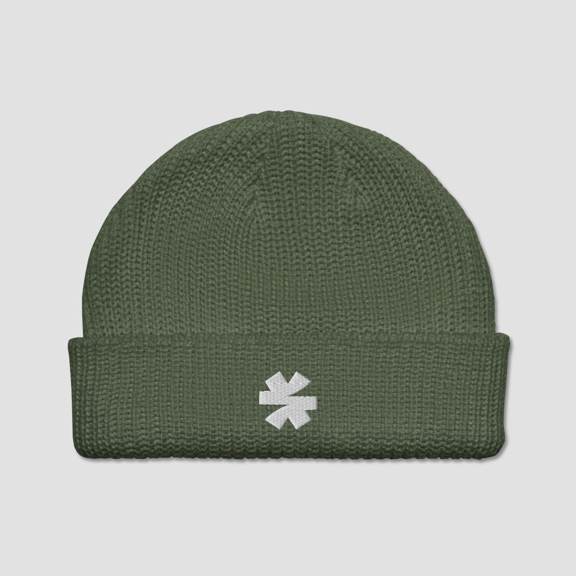 An olive green ribbed knit beanie hat with a white embroidered asterisk logo on the front cuff, shown against a light gray background.