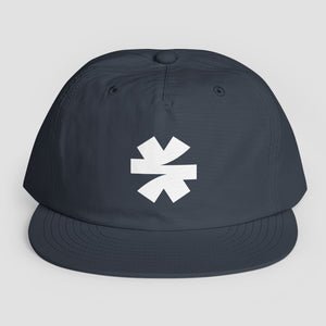 A dark navy blue snapback cap with a white asterisk logo on the front, displayed against a light gray background.