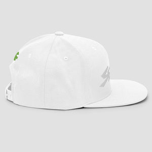 A white structured snapback cap with a flat brim, featuring a small green embroidered asterisk on the front and back and larger white embroidered text 'SENDIT' on the front, set against a solid light gray background.