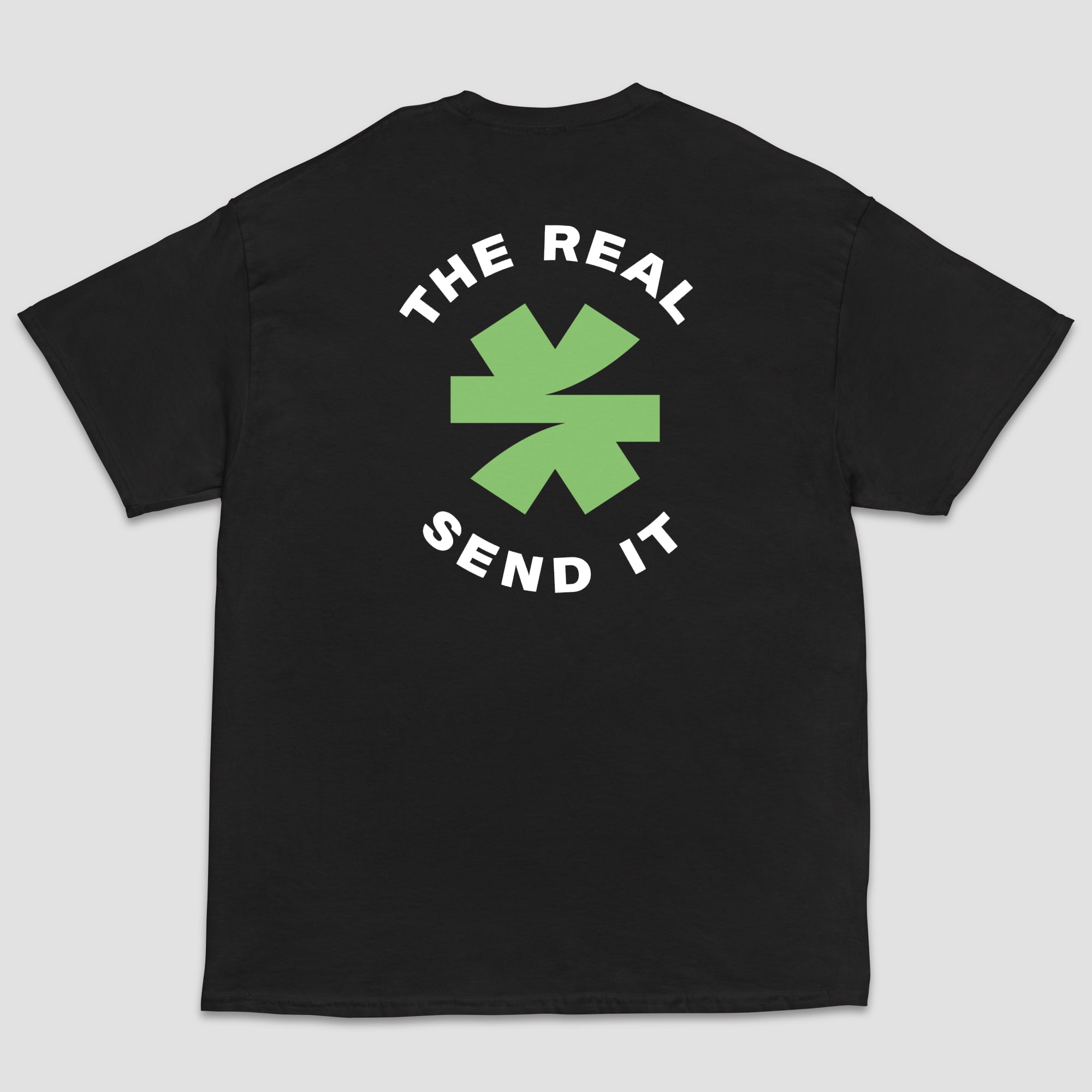 A black short-sleeve t-shirt shown from the back, featuring a green and black logo with the text 'THE REAL SEND IT' centered around a green asterisk set on a light gray background.