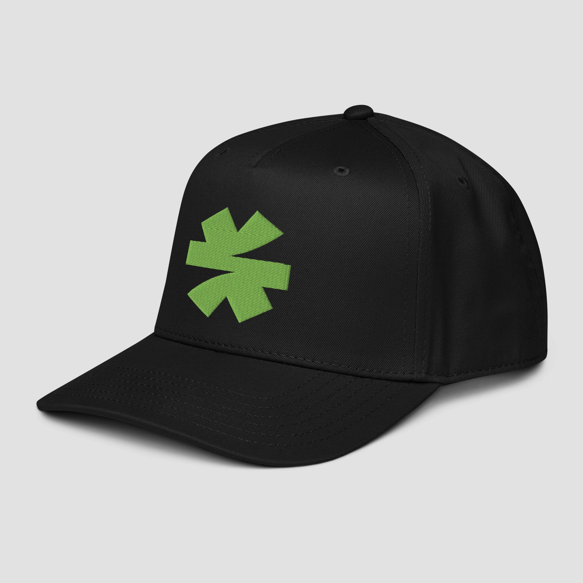 A black baseball cap featuring a bright green asterisk on the front, set against a solid light gray background.