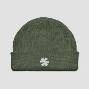 An olive green ribbed knit beanie hat with a white embroidered asterisk logo on the front cuff, shown against a light gray background.