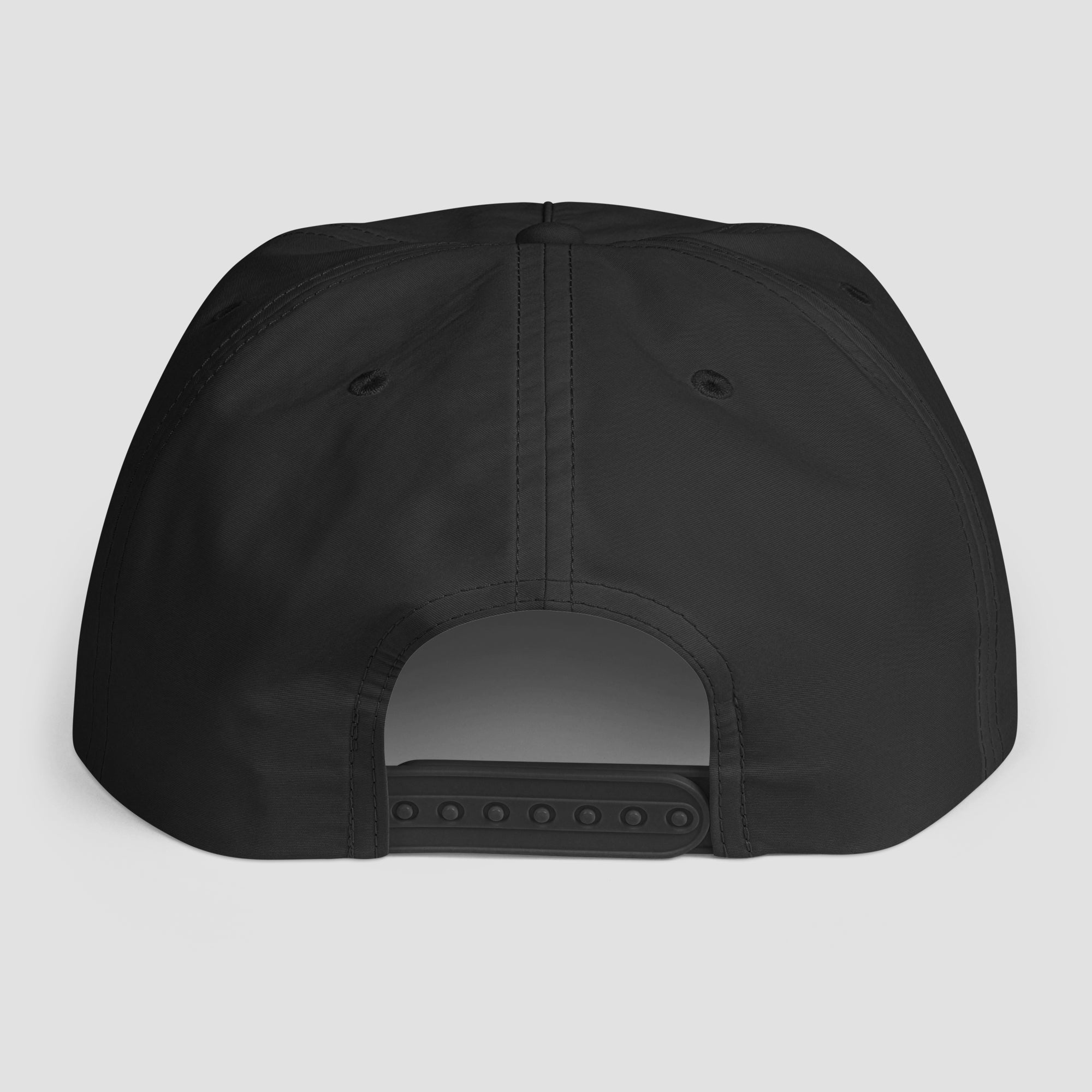 The back view of a black snapback cap on a light gray background.