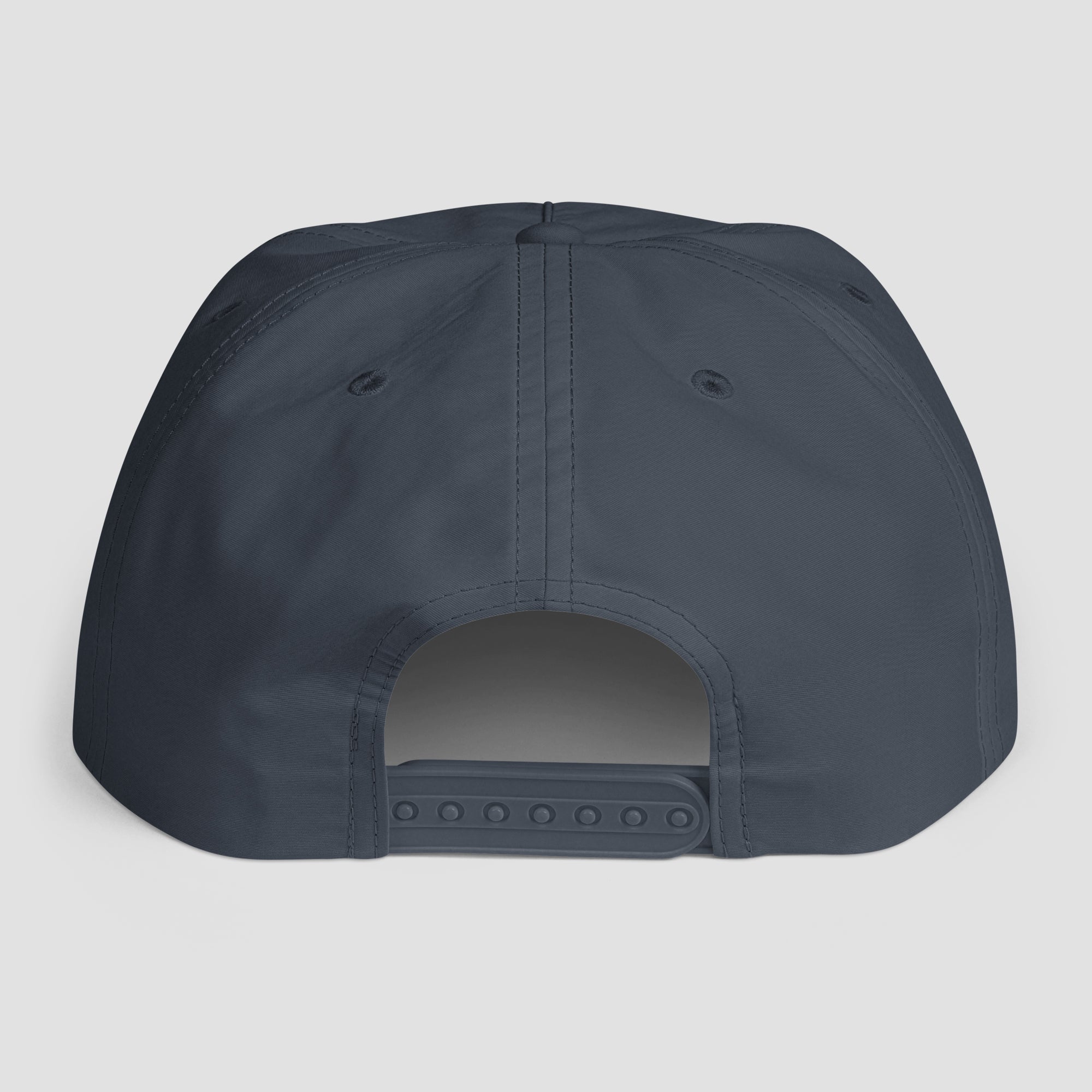 The back view of a snapback cap in a dark slate blue-gray color, shown against a light gray background.