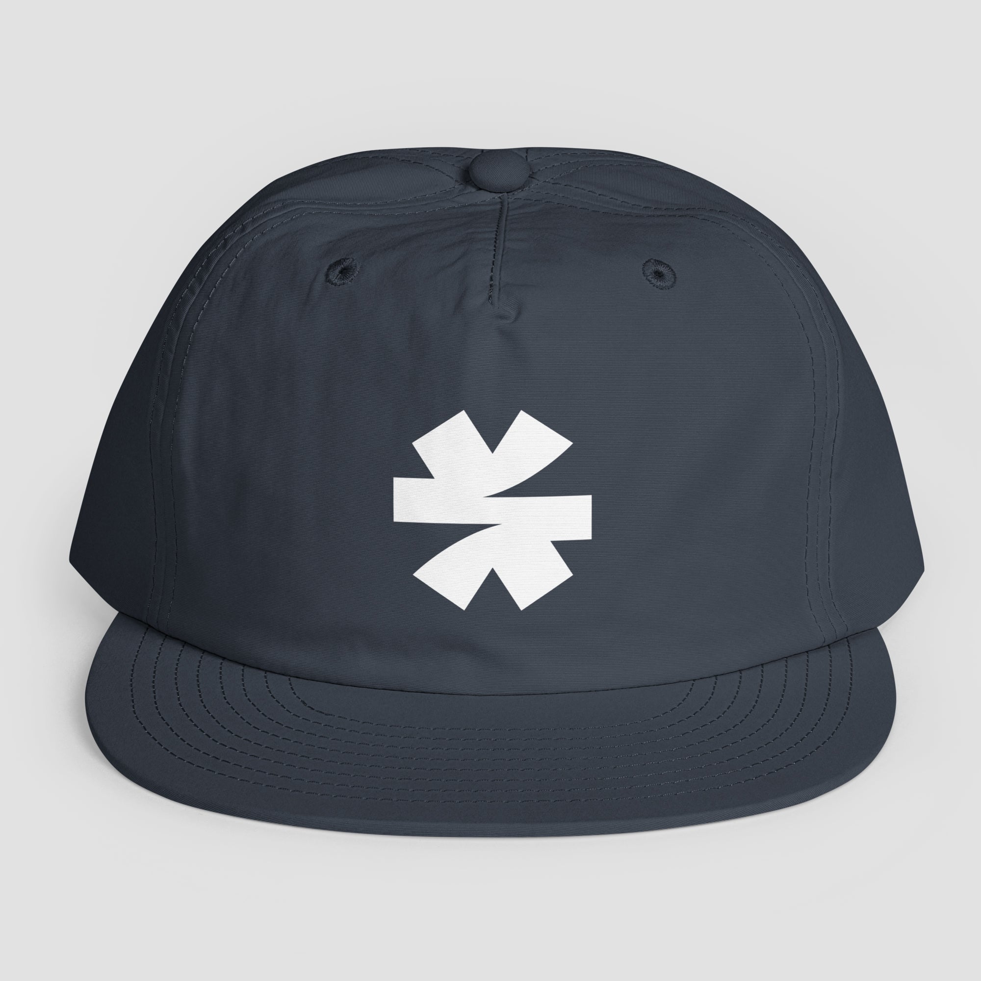 A dark navy blue snapback cap with a white asterisk logo on the front, displayed against a light gray background.