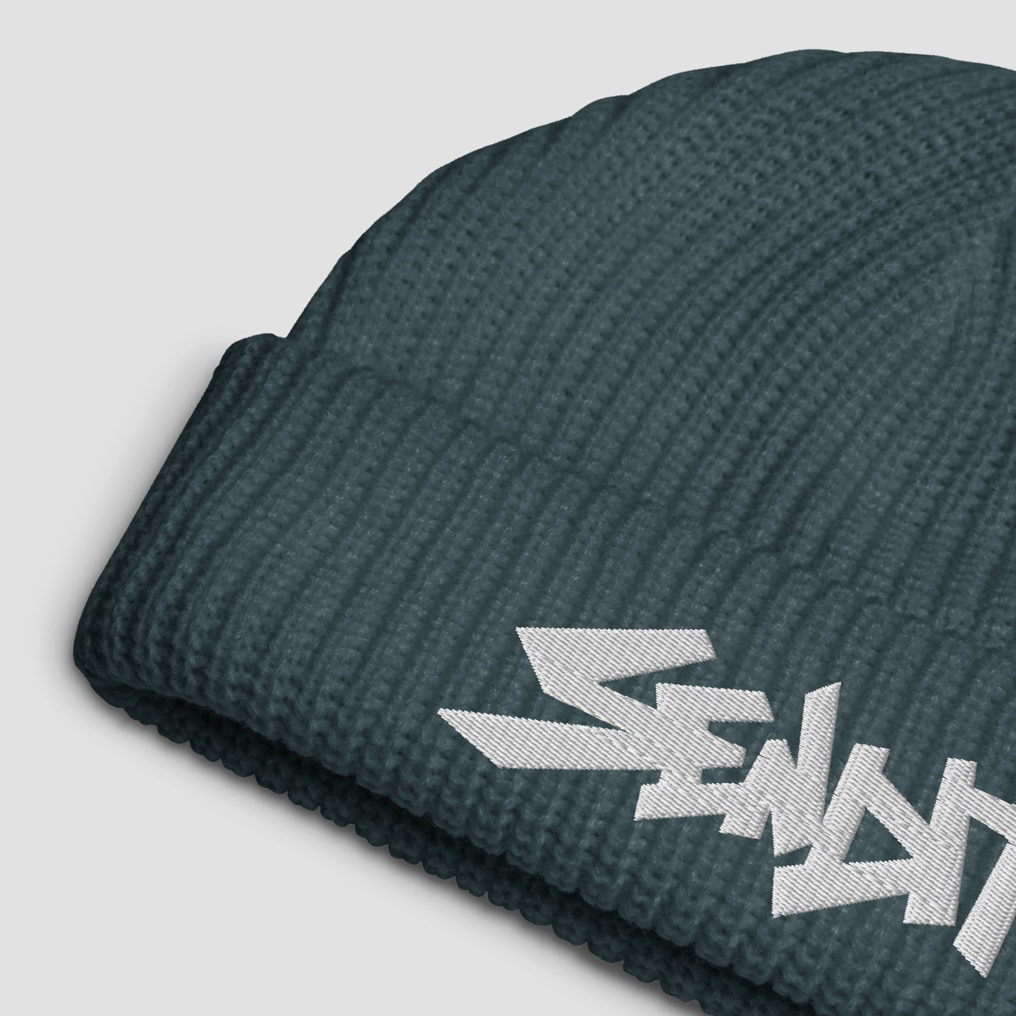 Blue-gray beanie with 'SENDIT' embroidery on a light gray background