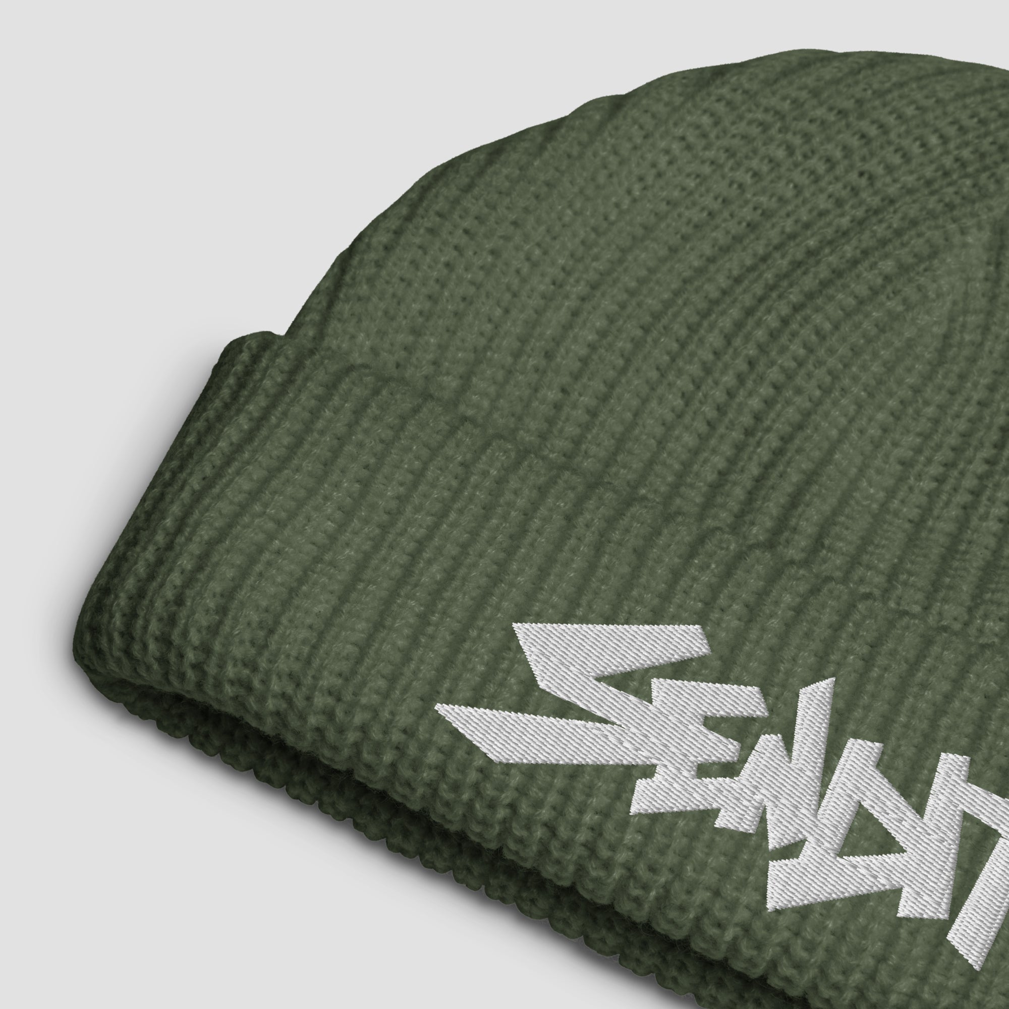 An olive green ribbed knit beanie hat featuring a white embroidered stylized 'SENDIT' logo on the cuff, shown against a light gray background.