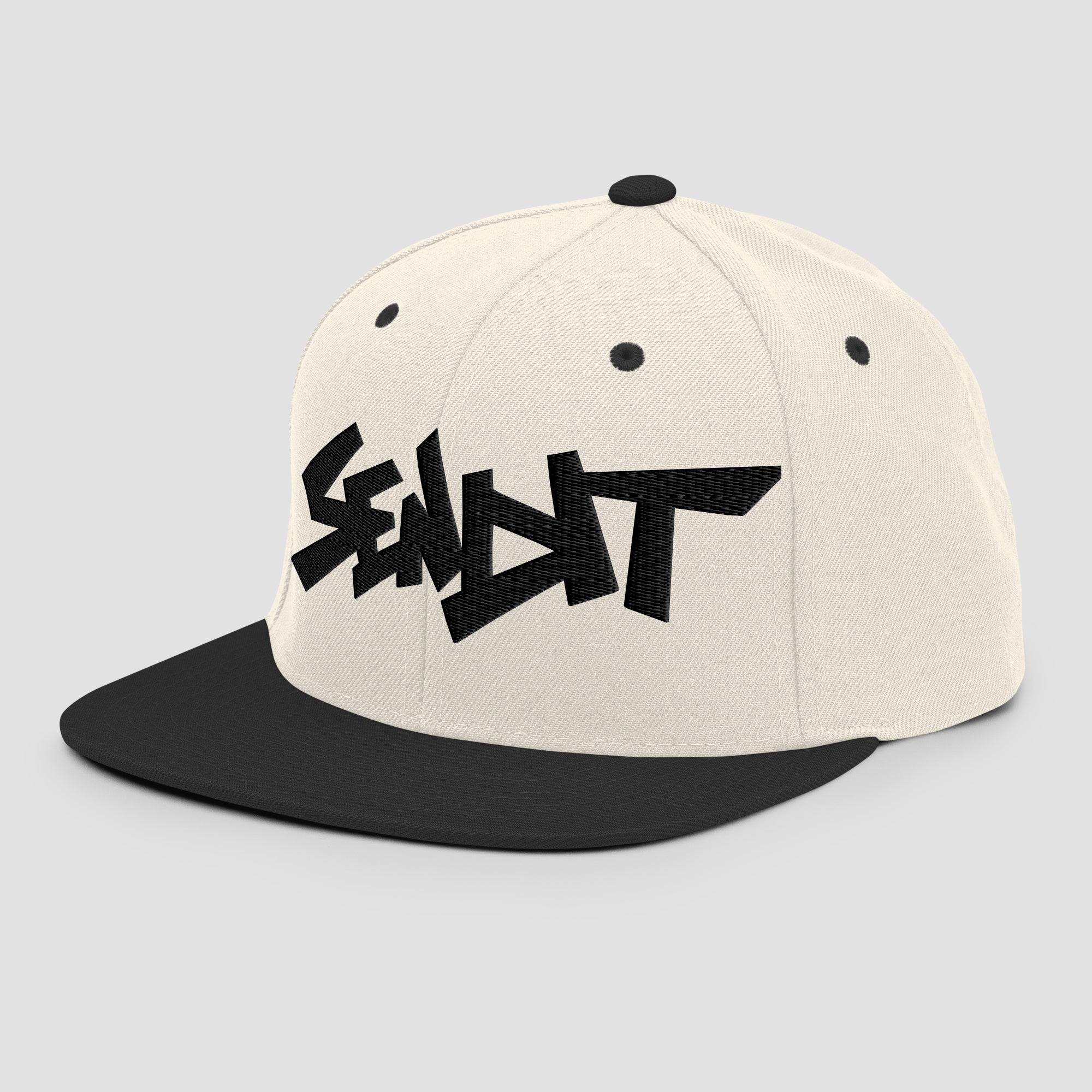 An off-white snapback cap with a black flat brim and a black embroidered stylized 'SENDIT' logo on the front, shown against a light gray background.