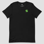 A black short-sleeve crewneck t-shirt with a small green asterisk on the left chest, displayed against a solid light gray background.
