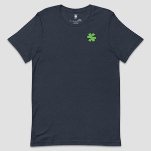 A dark navy blue crewneck t-shirt with a small green asterisk on the left chest, displayed flat against a light gray background.