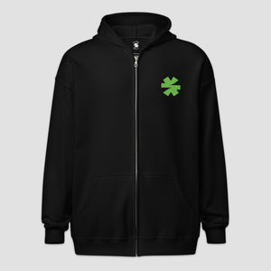 A black zip-up hoodie with a green asterisk graphic on the left chest, displayed on a light gray background.