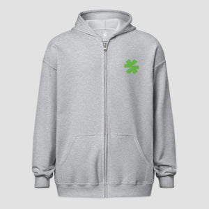 A light gray zip-up hoodie with a small green asterisk on the left chest, displayed against a solid light gray background.