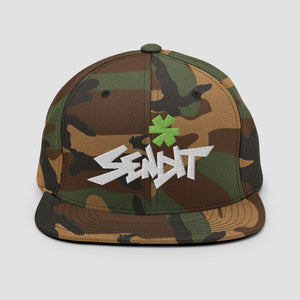 A camouflage flat-brim cap with a green asterisk graphic and white embroidered 'SENDIT' text on the front, shown against a light gray background.