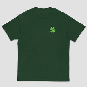 A dark green crewneck t-shirt with a small light green asterisk on the left chest, displayed against a solid light gray background.